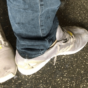 Taking blue ankle socks sneakers